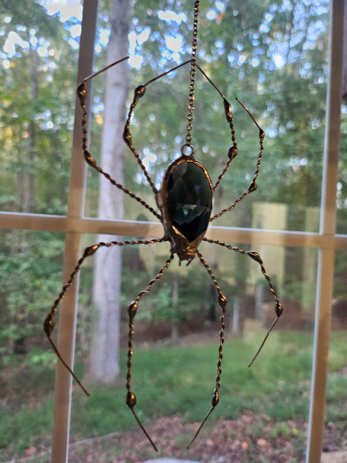 The Silver Weaver: Tiffany-style spider suncatcher with a copper-foiled black glass prism and hand-twisted silver soldered legs