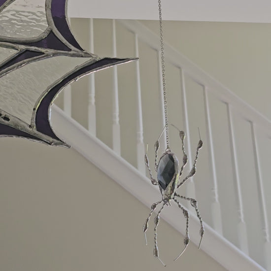 Video of The Amethyst Web, a Tiffany-style stained glass spider web suncatcher with a dangling glass-gem spider