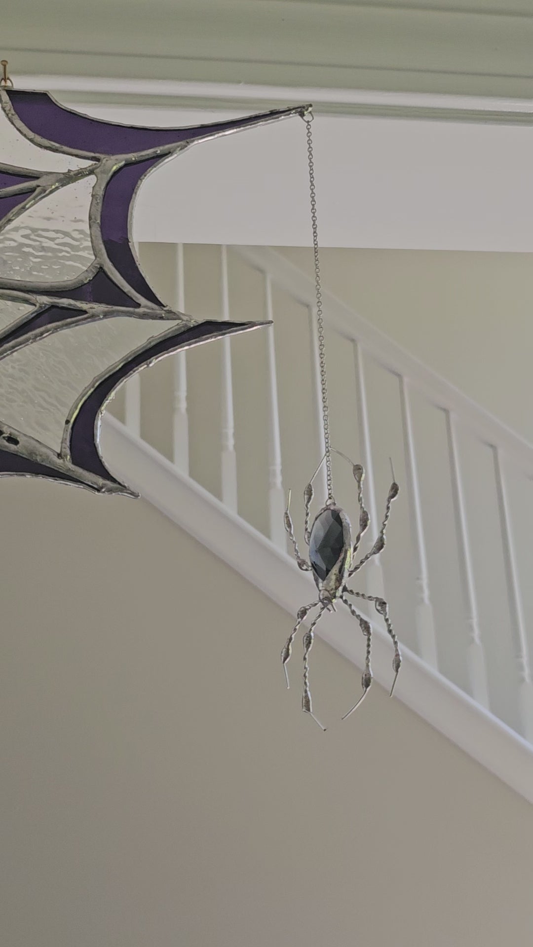 Video of The Amethyst Web, a Tiffany-style stained glass spider web suncatcher with a dangling glass-gem spider